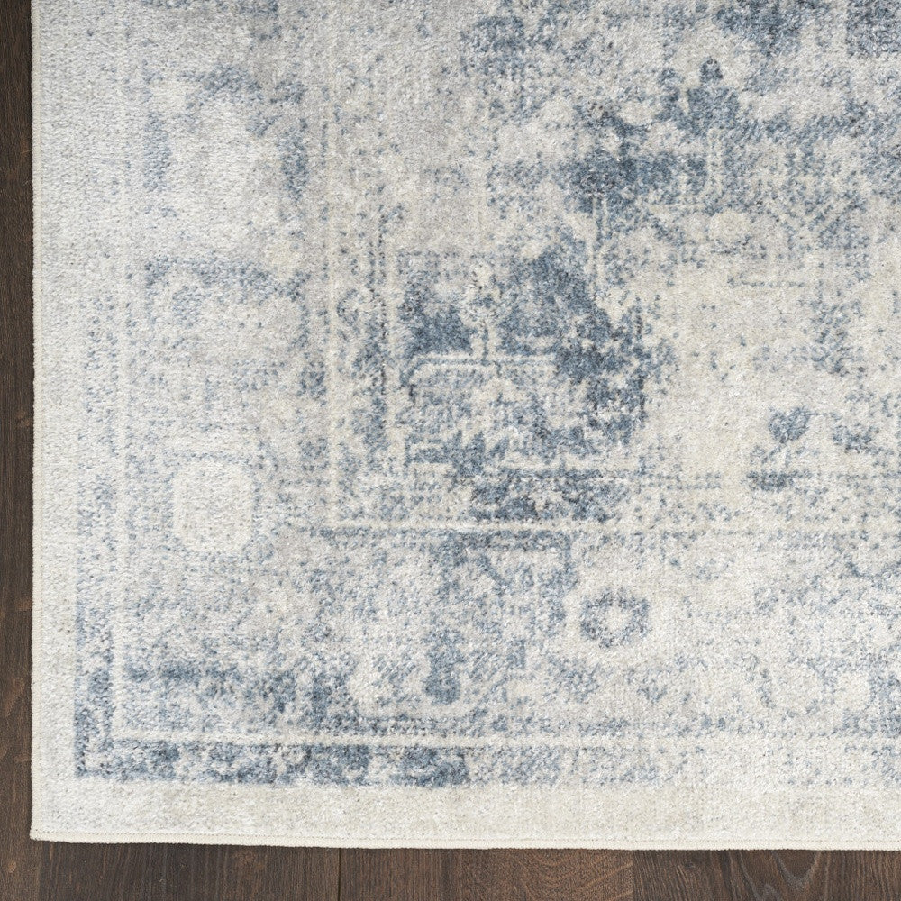 8' X 10' Blue and Ivory Abstract Power Loom Washable Area Rug