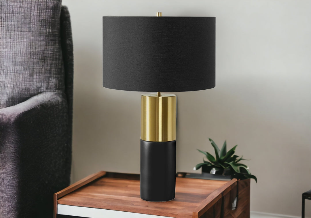 25" Black and Gold Concrete Cylinder Table Lamp With Black Drum Shade