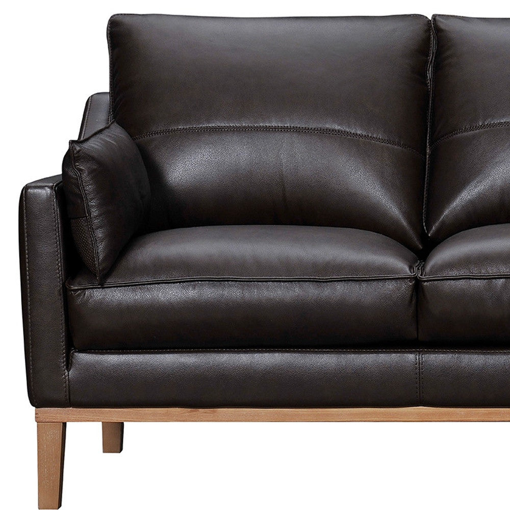 87" Dark Brown Leather Sofa And Toss Pillows With Brown Legs