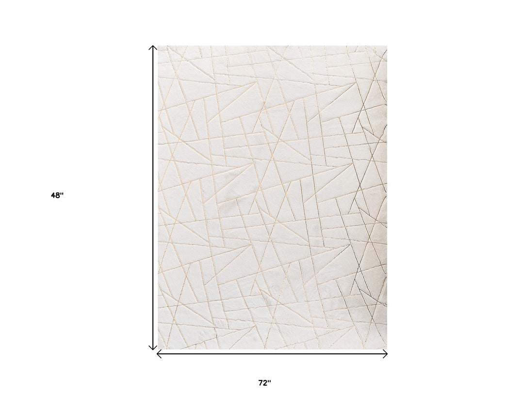 6' X 9' White and Gold Faux Sheepskin Abstract Geometric Machine Tufted Washable Non Skid Area Rug