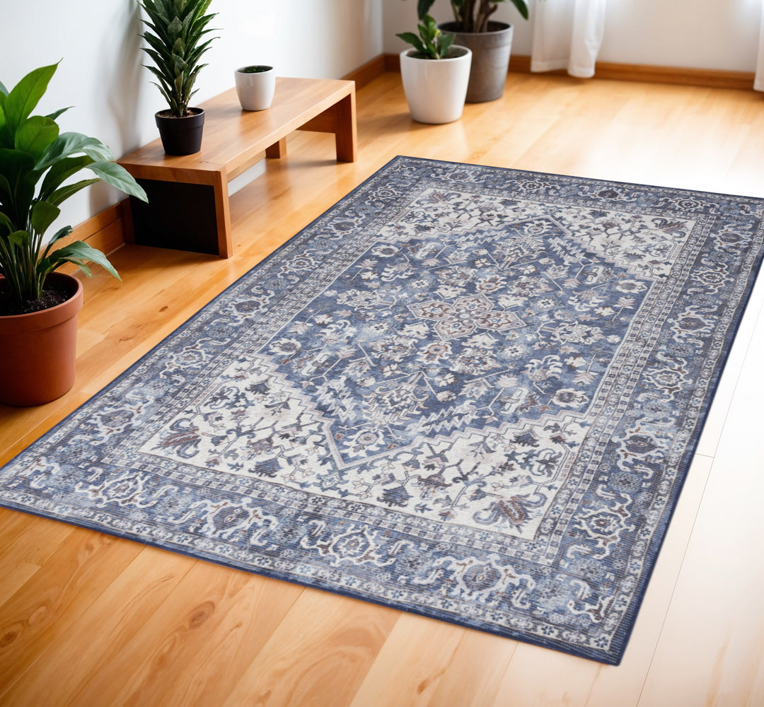 4' X 6' Blue and Ivory Floral Medallion Power Loom Distressed Area Rug