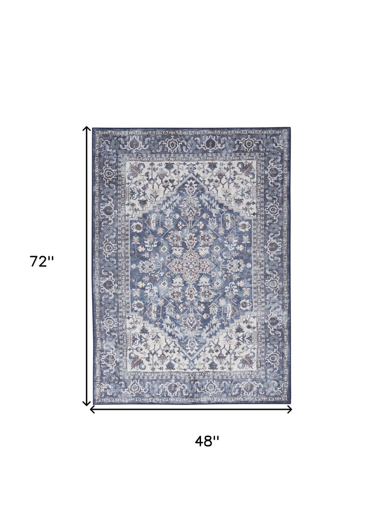 4' X 6' Blue and Ivory Floral Medallion Power Loom Distressed Area Rug