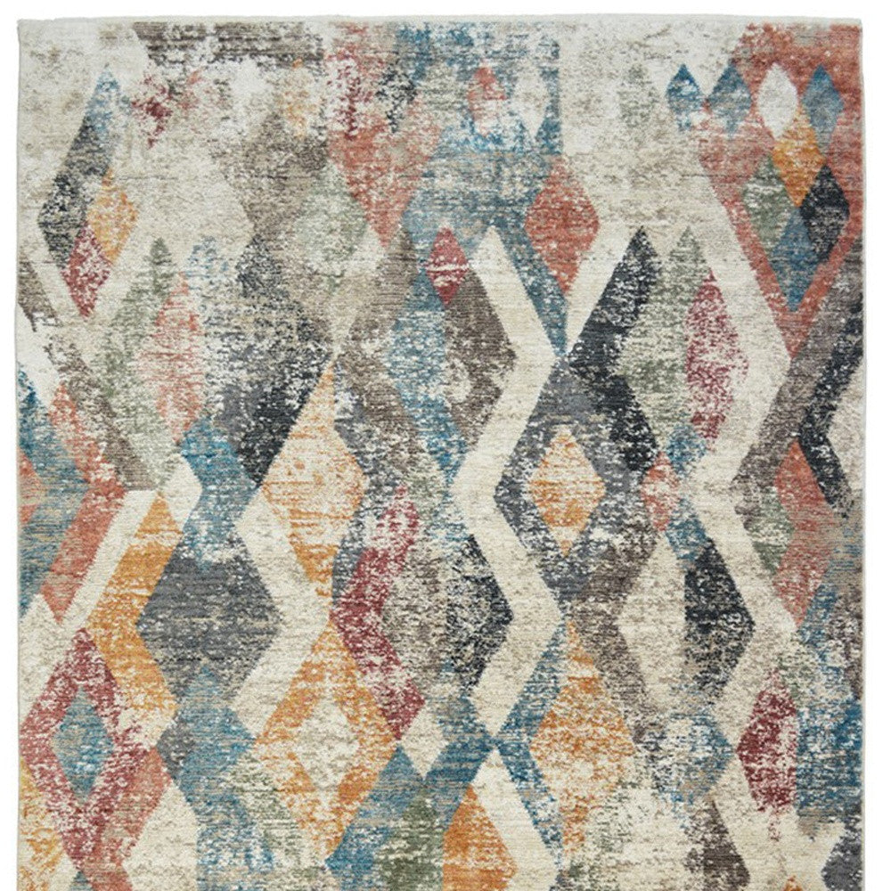 2' X 3' Beige Blue and Gray Geometric Distressed Area Rug With Fringe