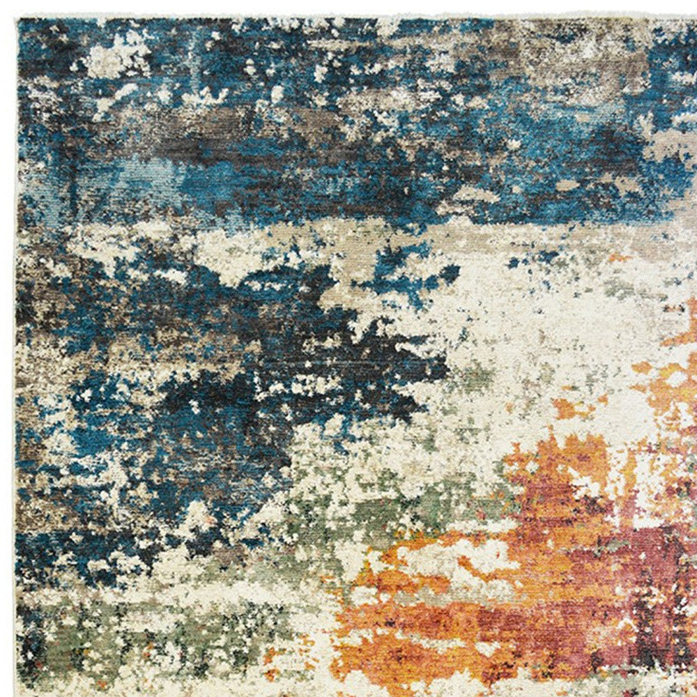 2' X 3' Beige Blue and Ivory Abstract Distressed Area Rug With Fringe