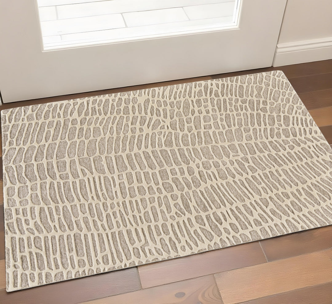 2' X 3' Tan and Ivory Wool Abstract Hand Tufted Area Rug