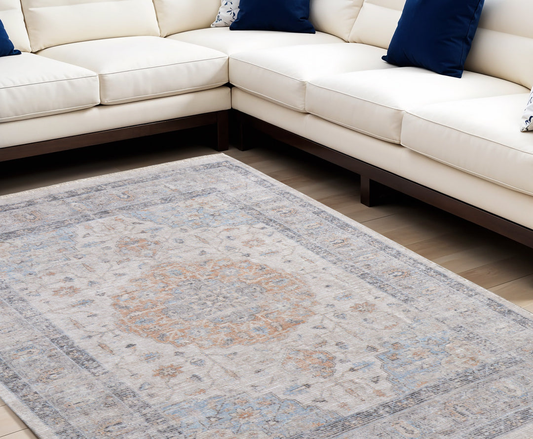 5' X 8' Ivory Blue and Orange Oriental Hand Woven Distressed Area Rug With Fringe