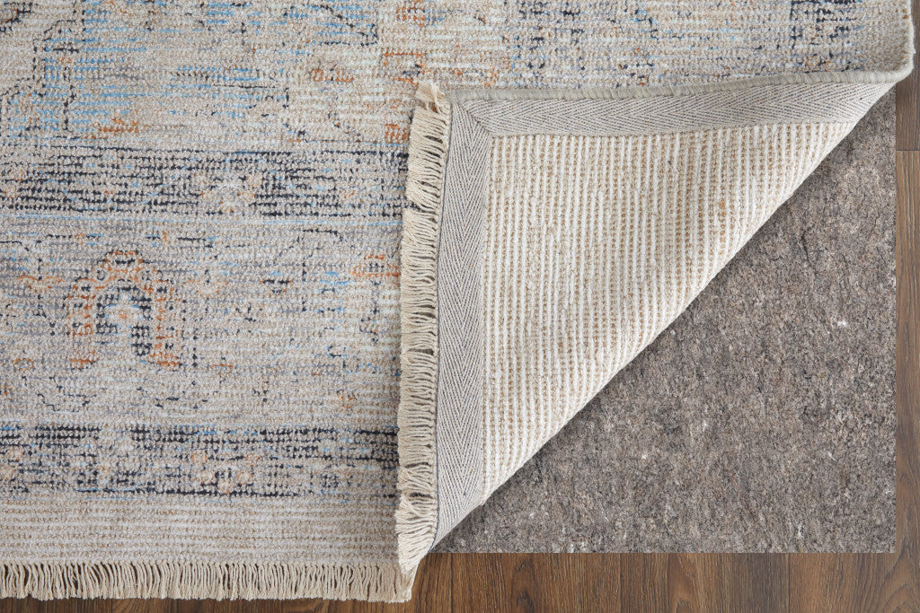 5' X 8' Ivory Blue and Orange Oriental Hand Woven Distressed Area Rug With Fringe