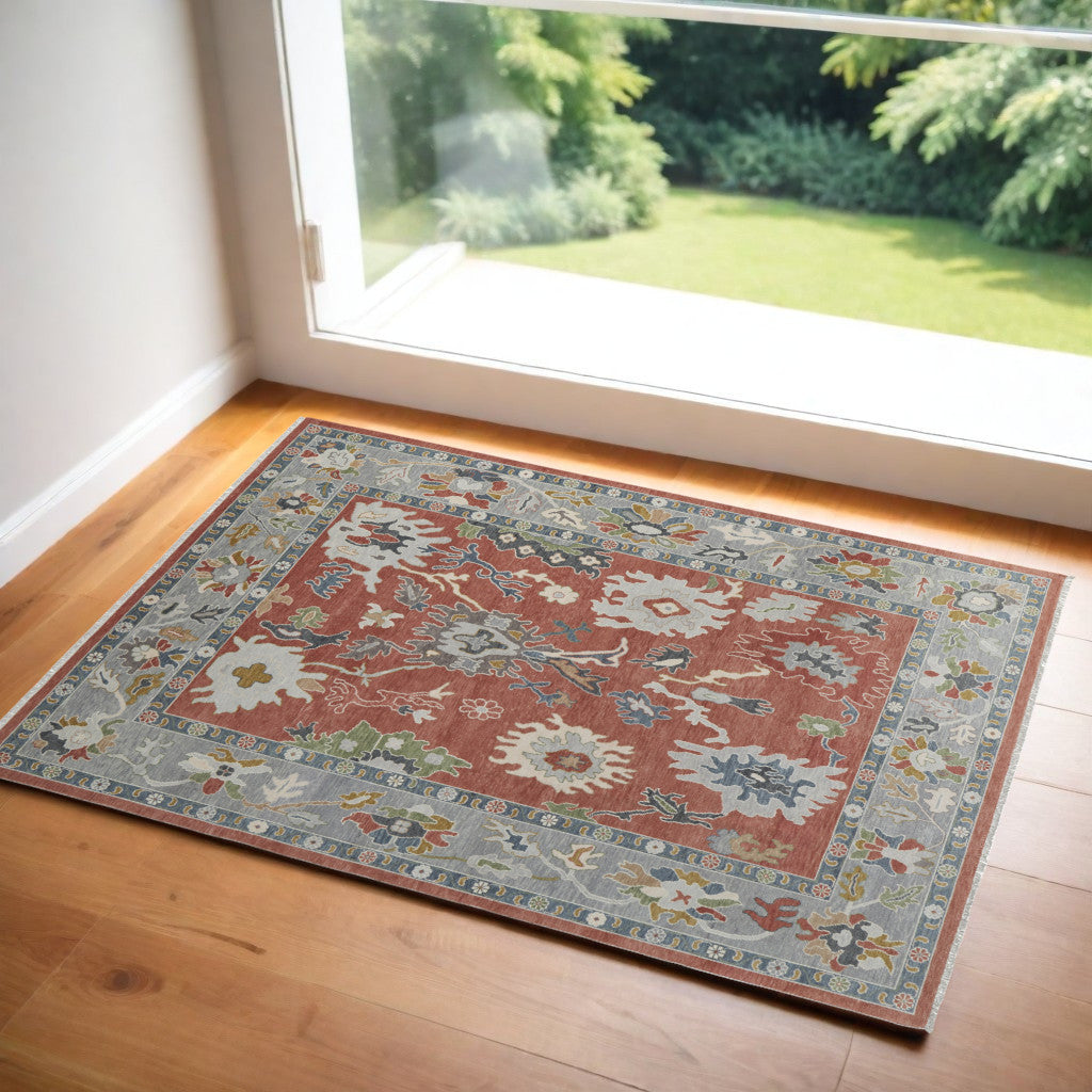 4' X 6' Gray Red and Ivory Wool Floral Hand Knotted Area Rug With Fringe