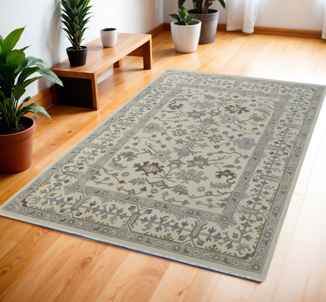 4' X 6' Ivory Gray and Brown Wool Floral Hand Knotted Area Rug With Fringe