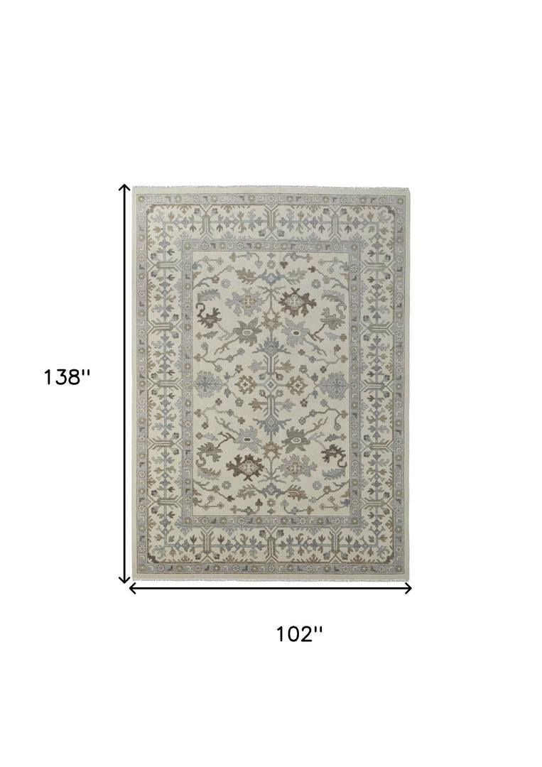 4' X 6' Ivory Gray and Brown Wool Floral Hand Knotted Area Rug With Fringe