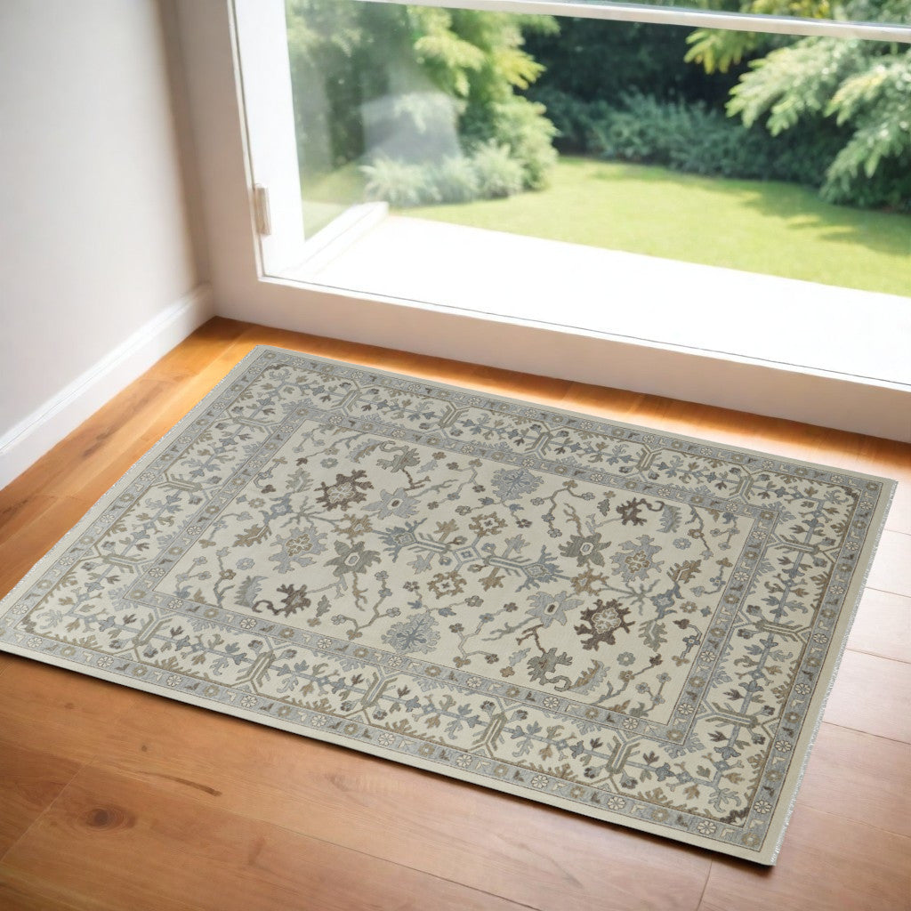 4' X 6' Ivory Gray and Brown Wool Floral Hand Knotted Area Rug With Fringe