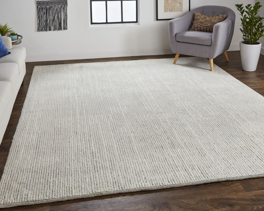 4' X 6' Tan and Ivory Wool Hand Knotted Area Rug