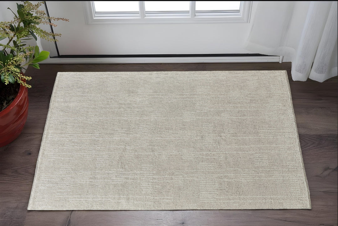 4' X 6' Tan and Ivory Wool Hand Knotted Area Rug