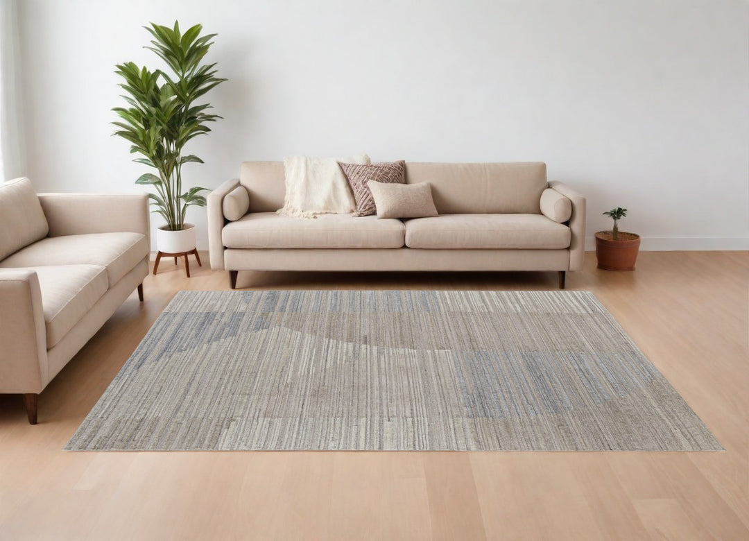 9' X 12' Tan and Blue Abstract Hand Woven Worn Faded Area Rug