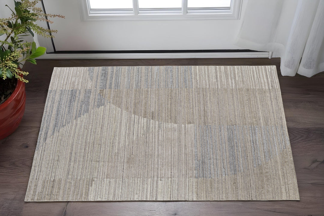 9' X 12' Tan and Blue Abstract Hand Woven Worn Faded Area Rug