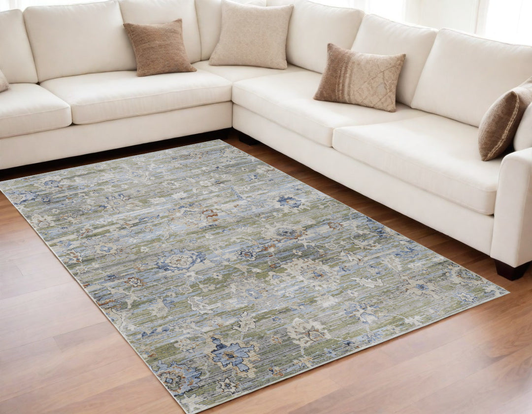 5' X 8' Ivory Green and Blue Floral Power Loom Worn Faded Area Rug