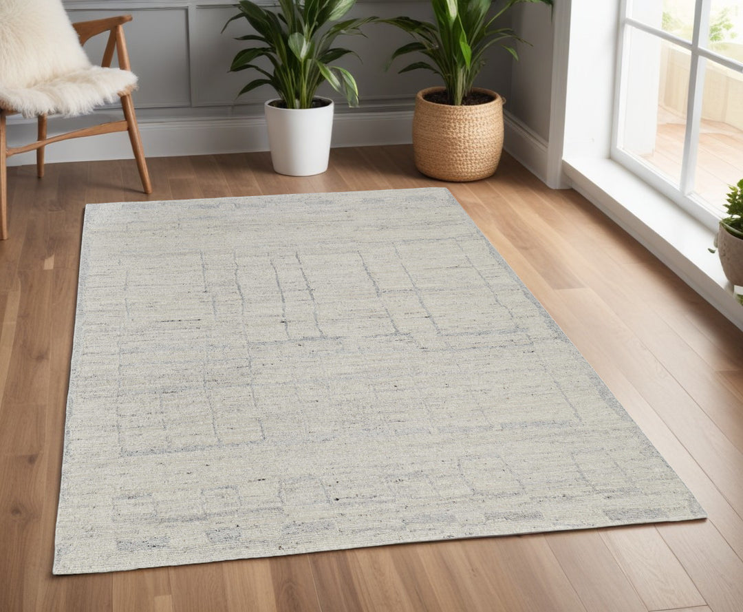 4' X 6' Gray and Ivory Abstract Hand Woven Worn Faded Area Rug