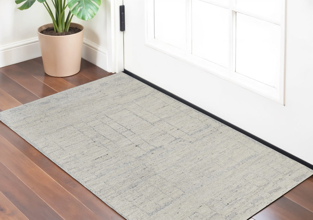 4' X 6' Gray and Ivory Abstract Hand Woven Worn Faded Area Rug