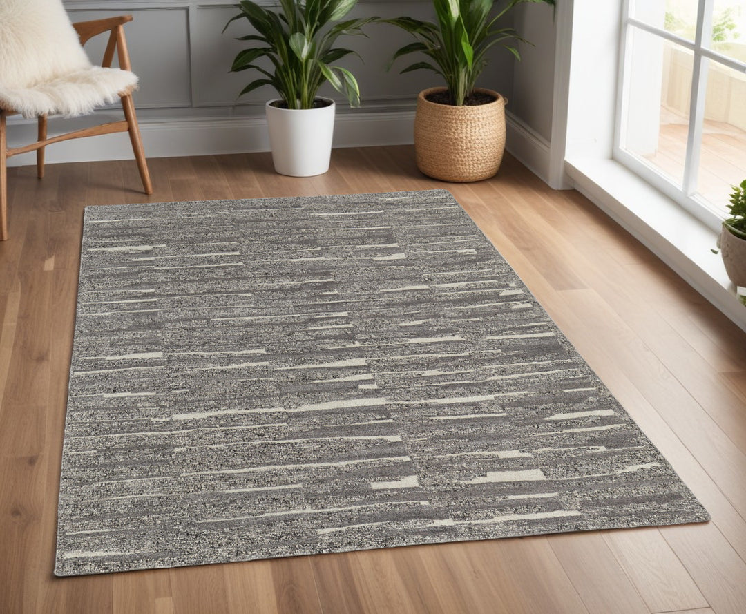 4' X 6' Gray Ivory and Taupe Abstract Hand Woven Area Rug