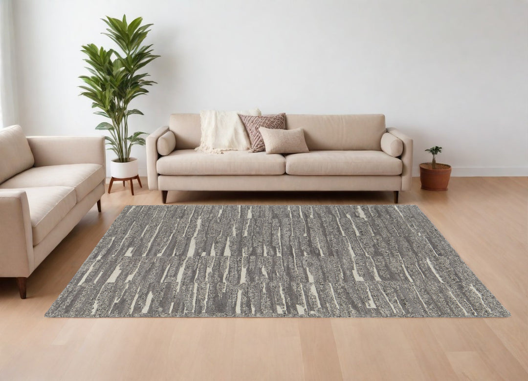 4' X 6' Gray Ivory and Taupe Abstract Hand Woven Area Rug