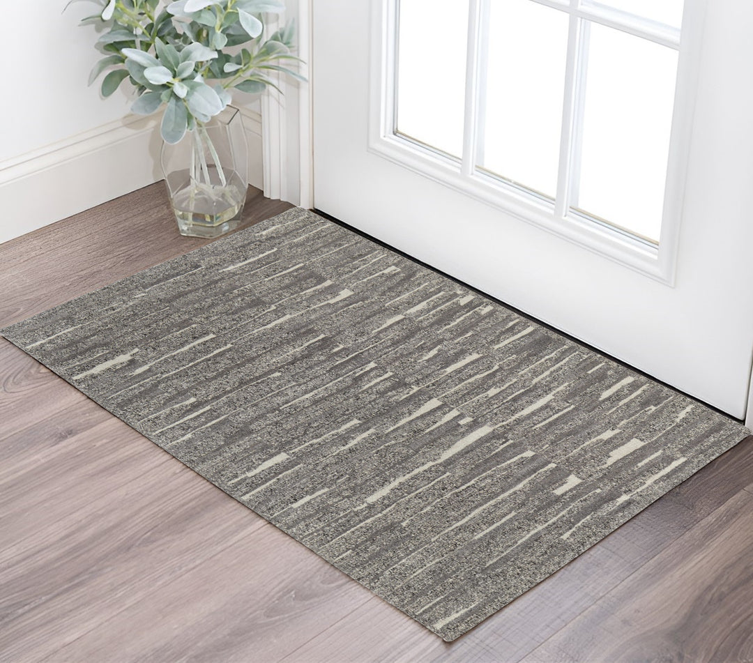 4' X 6' Gray Ivory and Taupe Abstract Hand Woven Area Rug