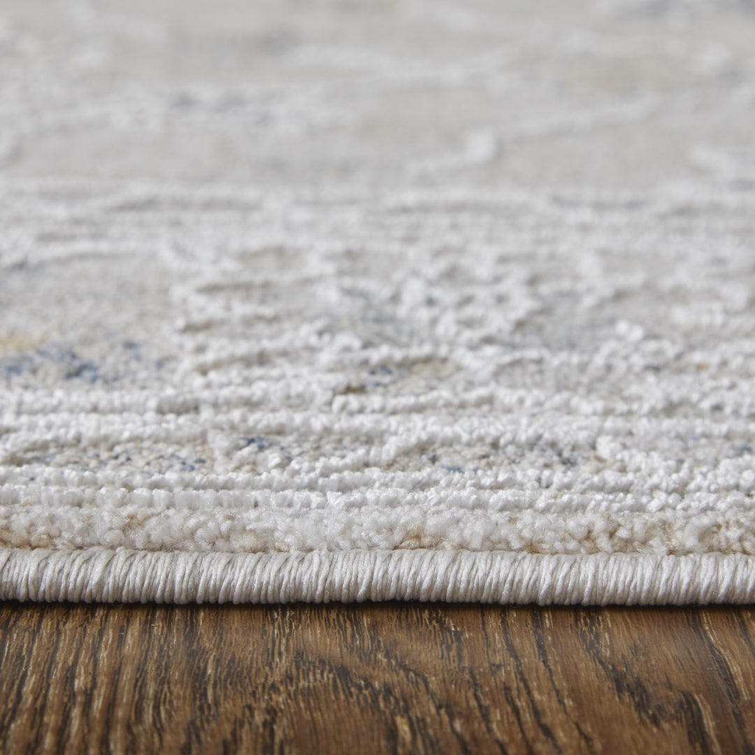 5' X 8' Ivory Taupe and Blue Floral Power Loom Worn Faded Area Rug With Fringe