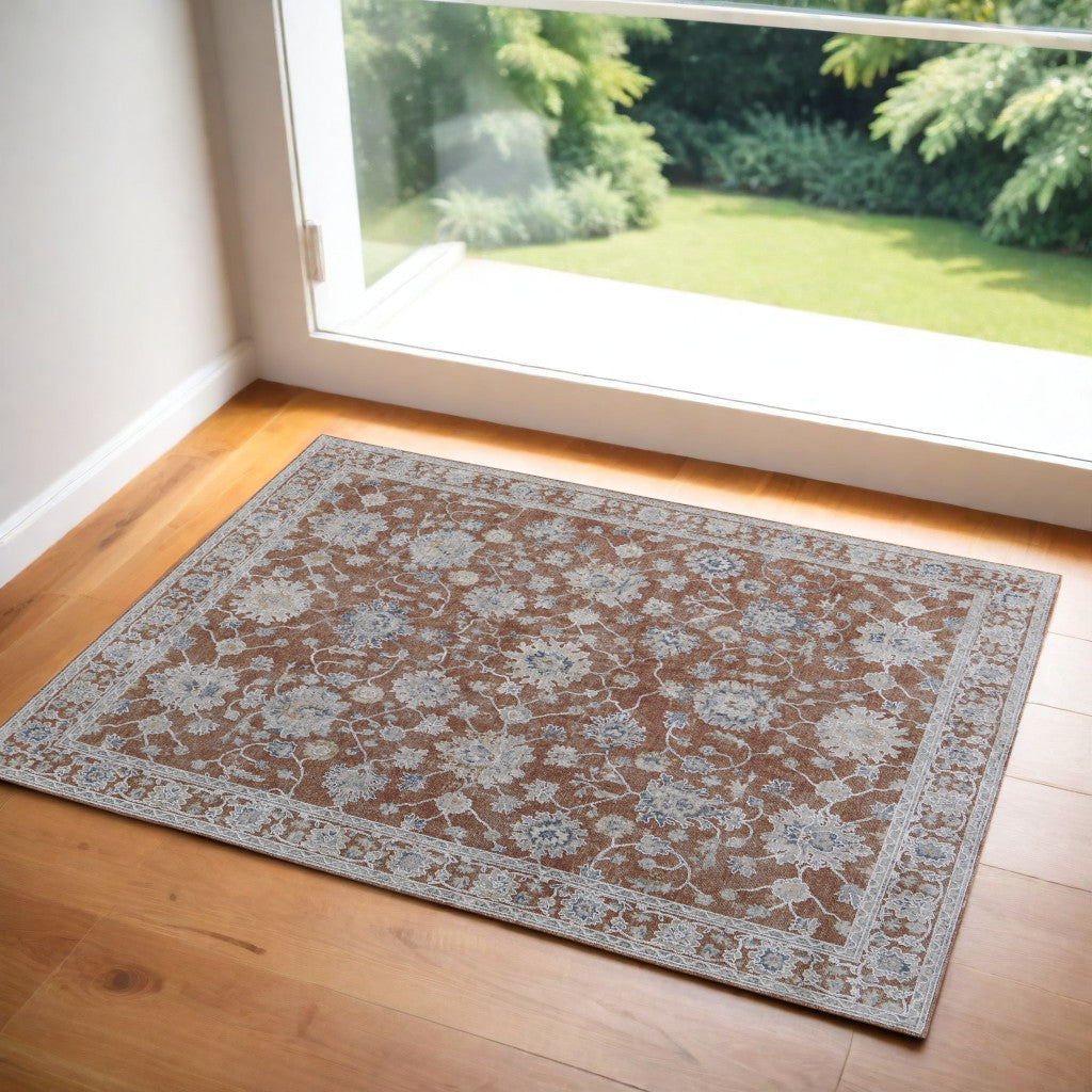 5' X 8' Ivory Taupe and Blue Floral Power Loom Worn Faded Area Rug With Fringe