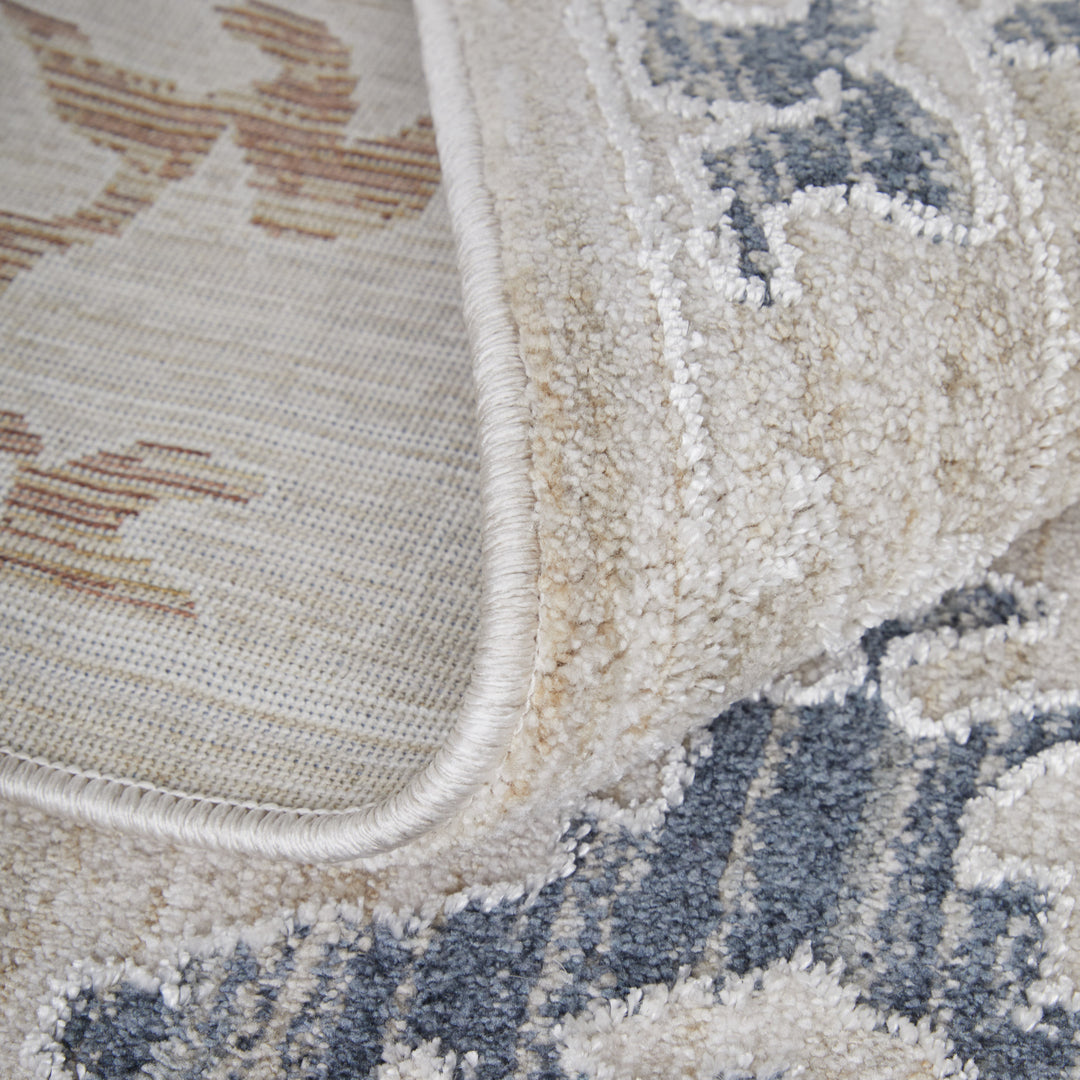 5' X 8' Ivory Blue and Gold Floral Power Loom Worn Faded Area Rug With Fringe