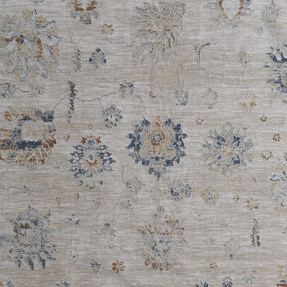 5' X 8' Ivory Taupe and Blue Floral Power Loom Worn Faded Area Rug With Fringe